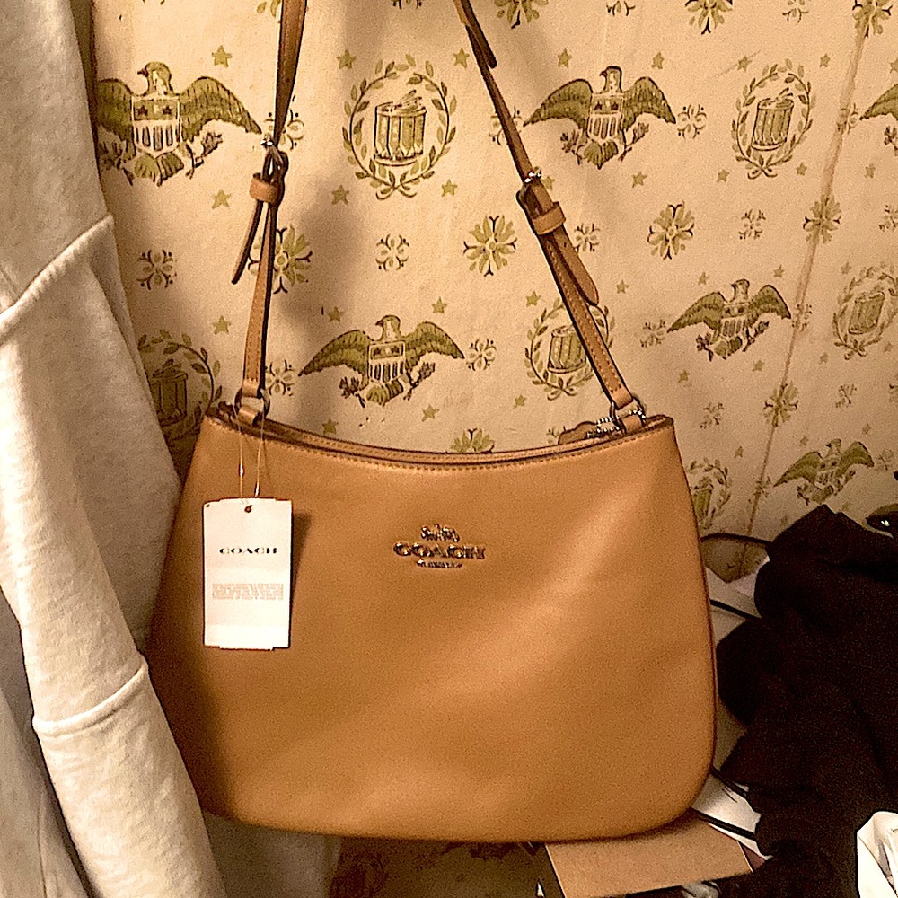 Coach sm-md tan handbag. Msrp$430 comparable value $350